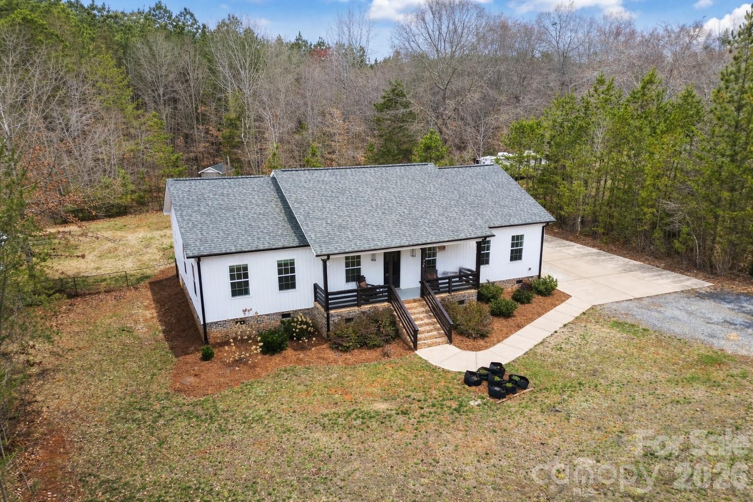 731 Miles Road Dallas, NC 28034 - Photo 2 of 45 an aerial view of a house with yard and seating space