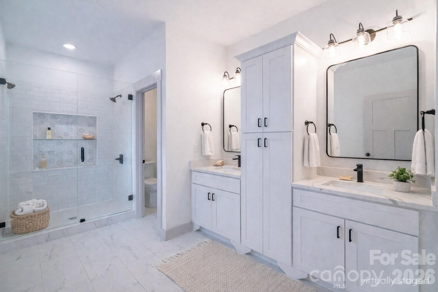 731 Miles Road Dallas, NC 28034 - Photo 24 of 45 a spacious bathroom with a double vanity sink mirror and shower