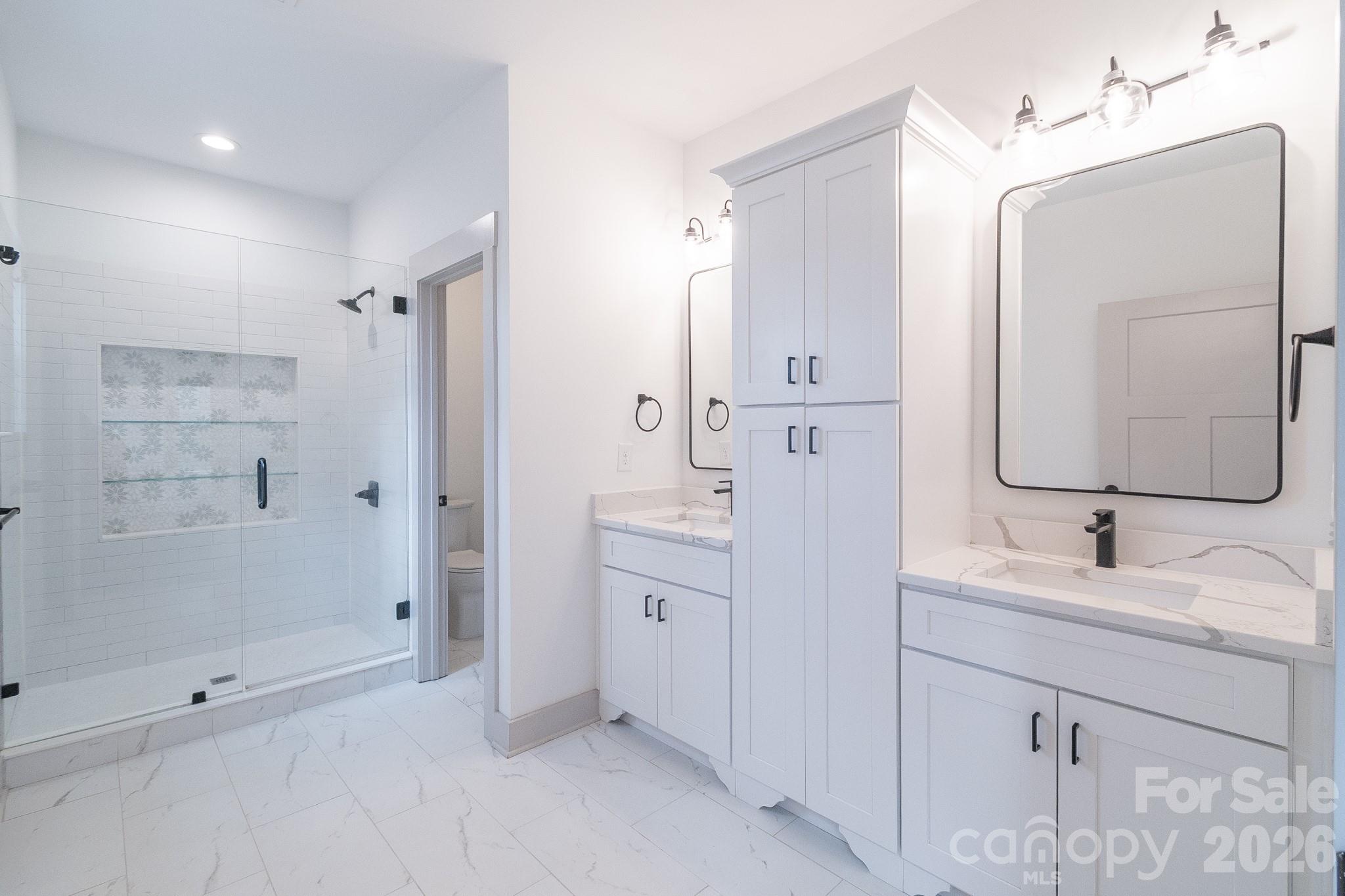 731 Miles Road Dallas, NC 28034 - Photo 25 of 45 a spacious bathroom with double sink and a mirror