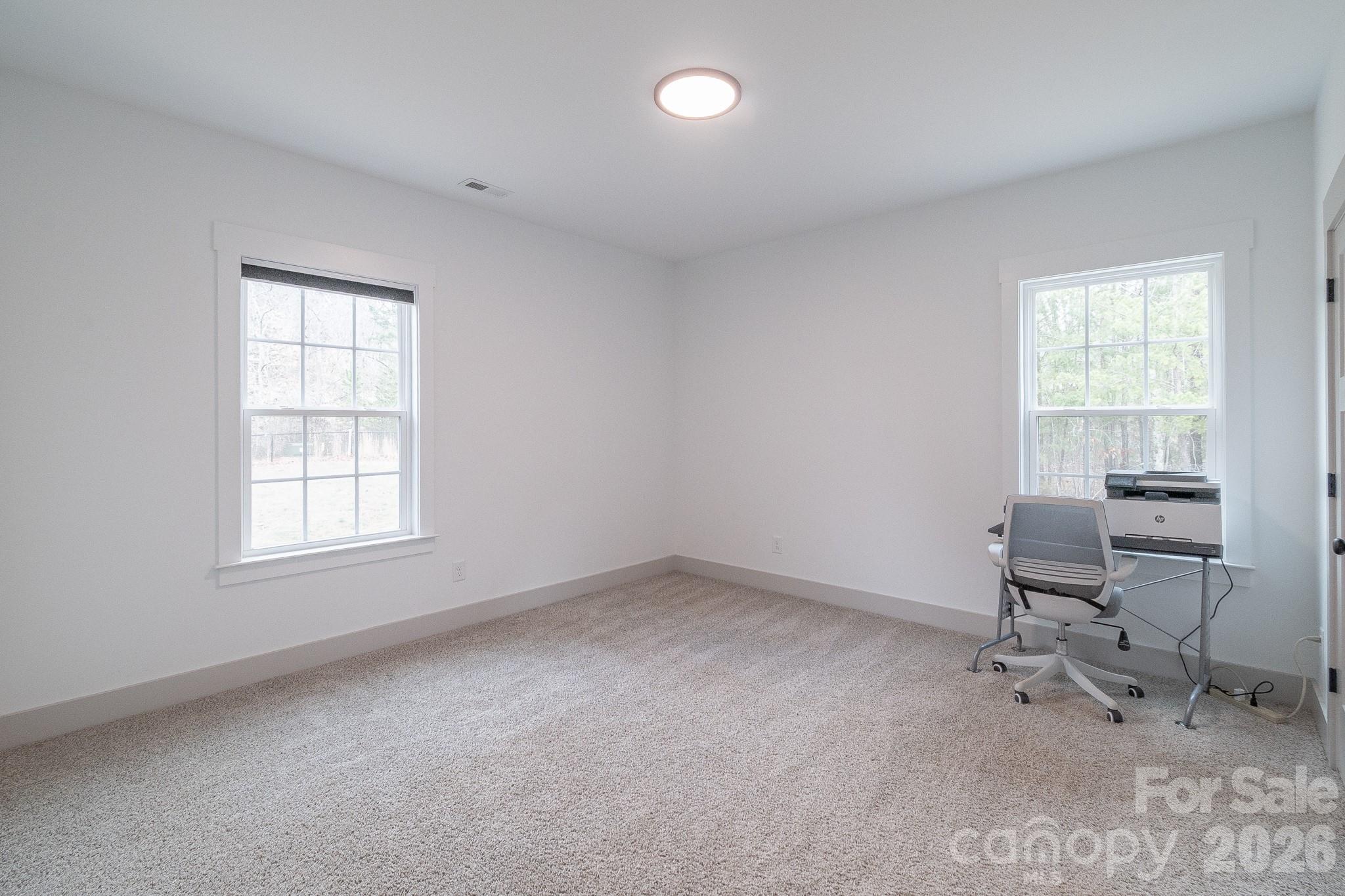 731 Miles Road Dallas, NC 28034 - Photo 29 of 45 a view of a workspace with furniture and a window