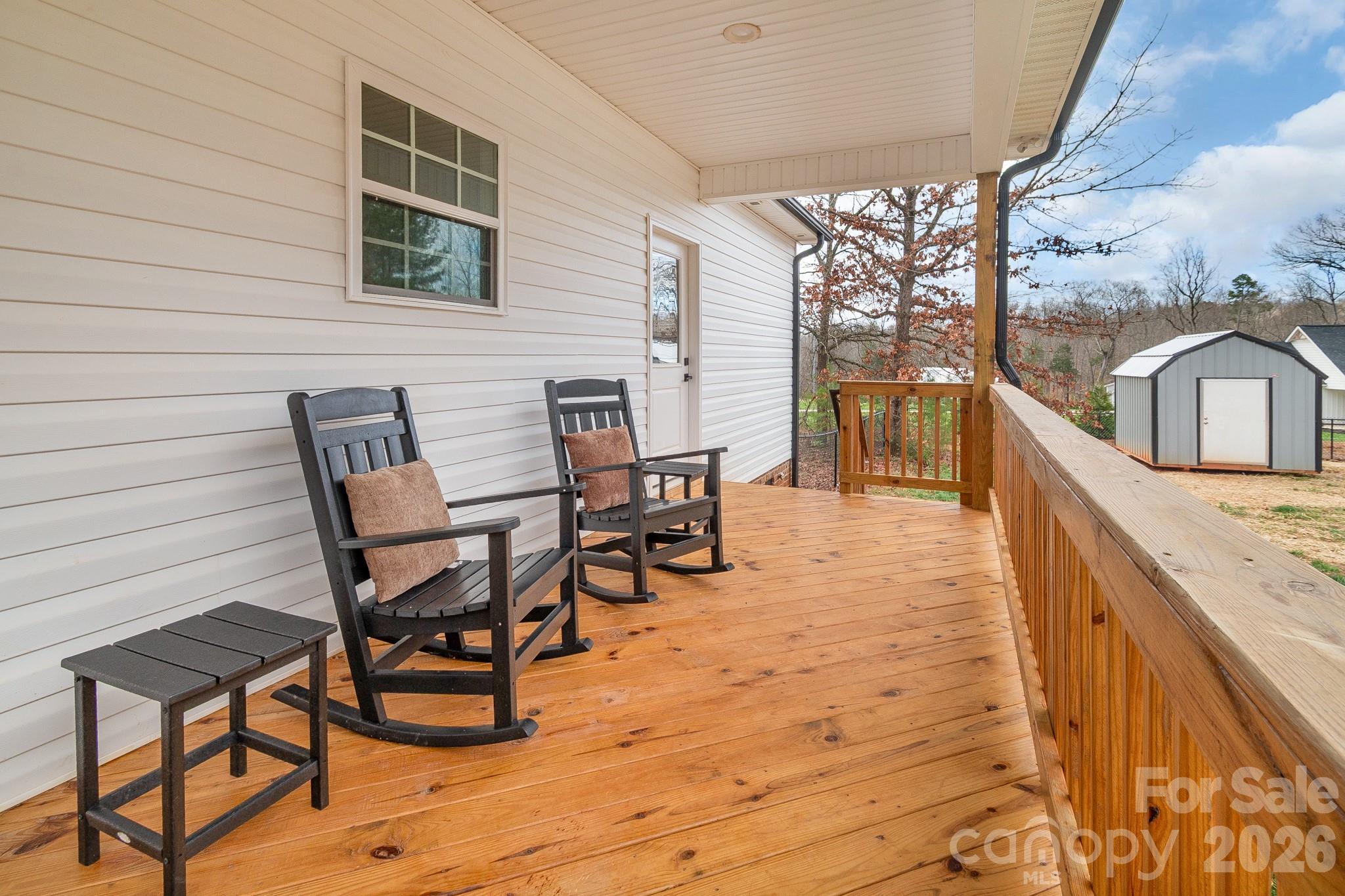 731 Miles Road Dallas, NC 28034 - Photo 36 of 45 a view of a patio with dining table and chairs