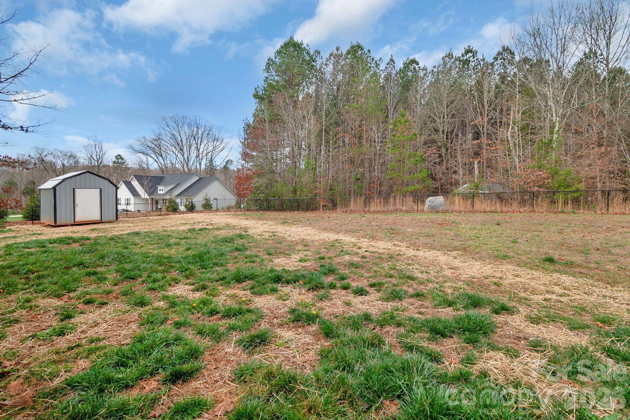 731 Miles Road Dallas, NC 28034 - Photo 39 of 45 a backyard of a house with lots of green space