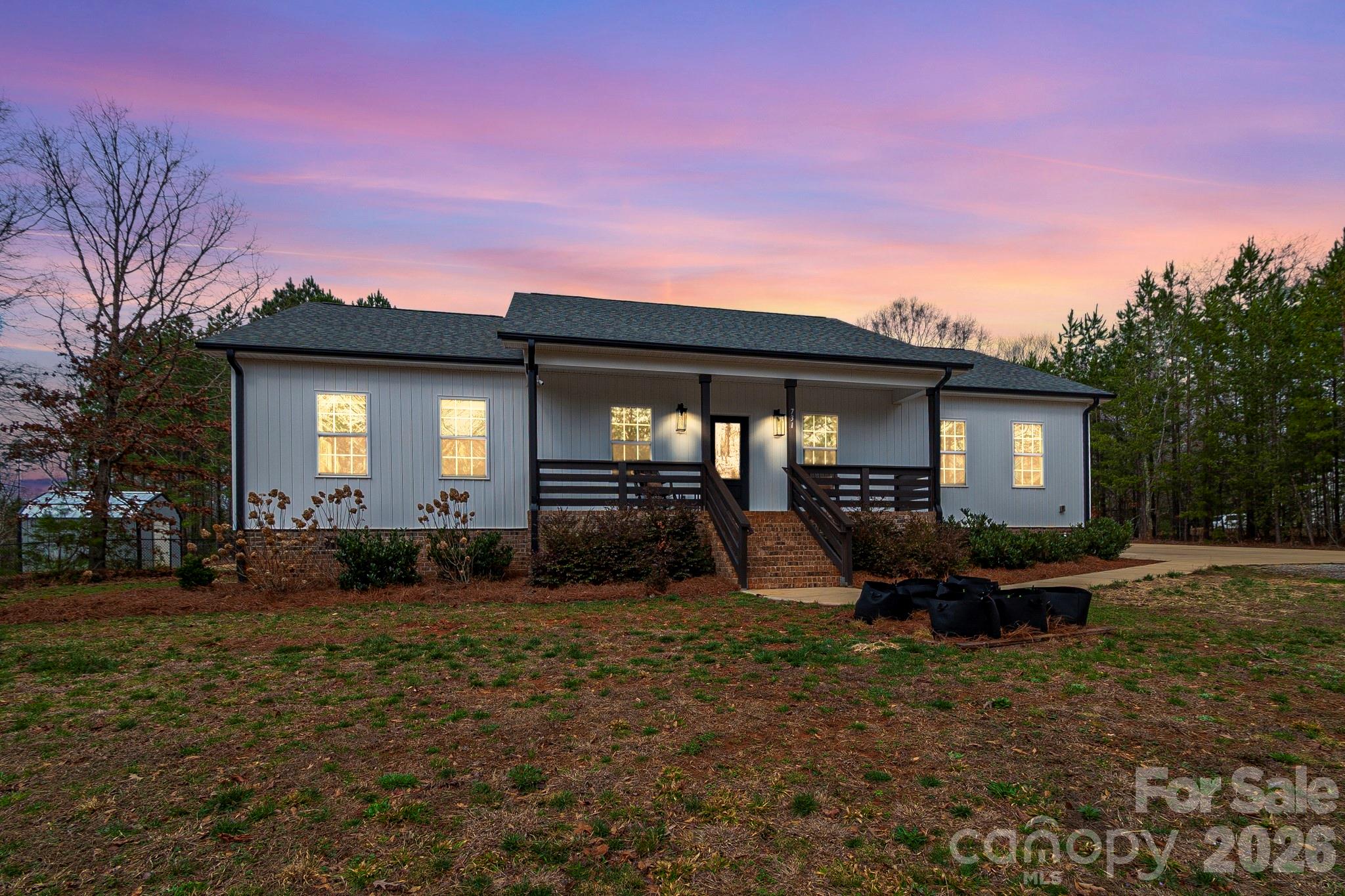 731 Miles Road Dallas, NC 28034 - Photo 41 of 45 a front view of a house with outdoor seating