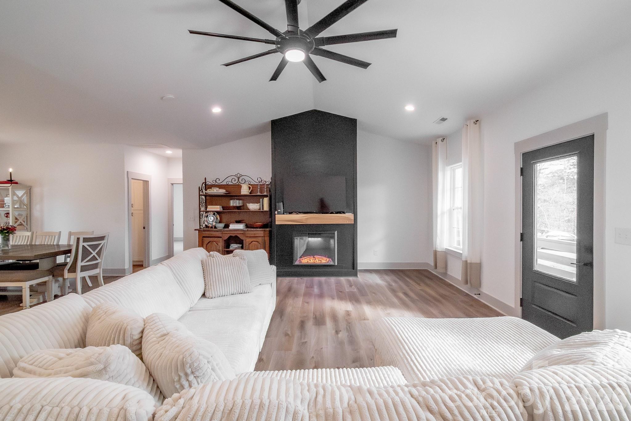 731 Miles Road Dallas, NC 28034 - Photo 5 of 45 a living room with furniture and a fireplace
