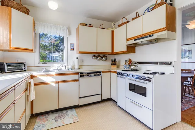 a bedroom with a bed table and a window