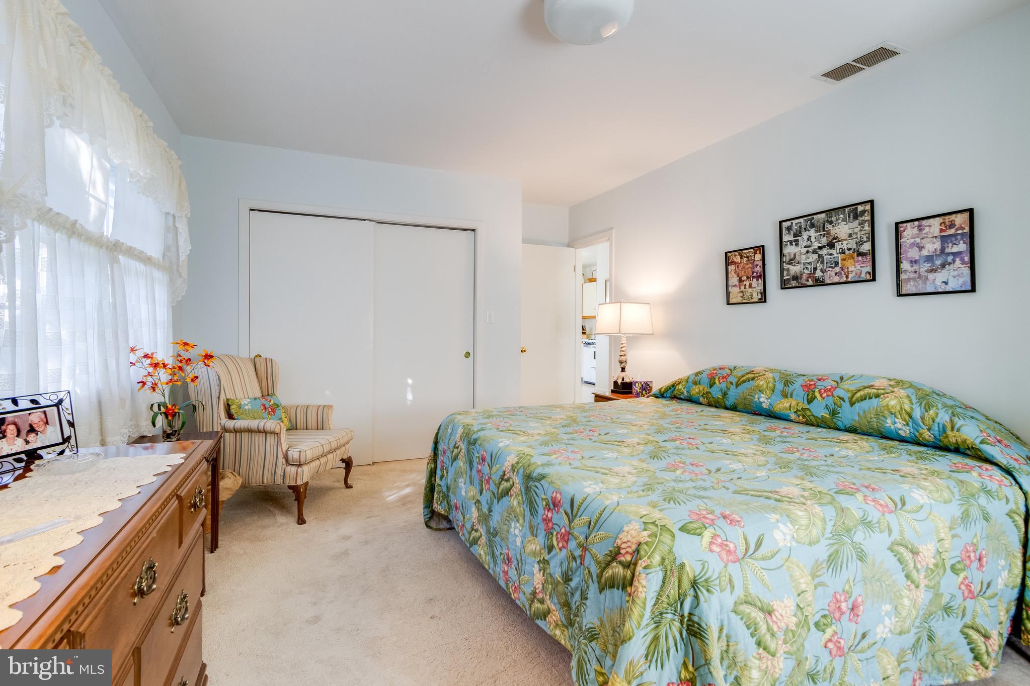 28 Delaware Avenue Rehoboth Beach, DE 19971 - Photo 29 of 44 a bedroom with a bed and a couch