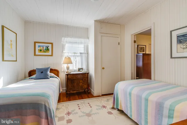 a view of a patio with table and chairs under an umbrella