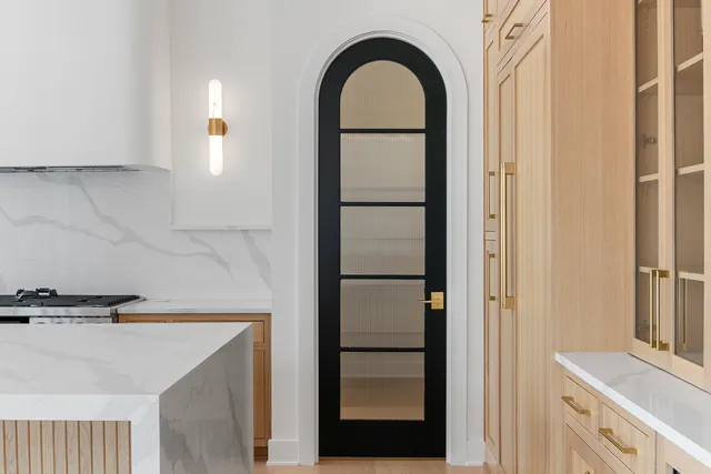 a view of a livingroom with furniture and a kitchen