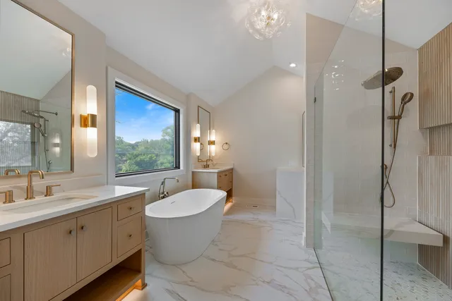 a white bath tub sitting next to a white sink