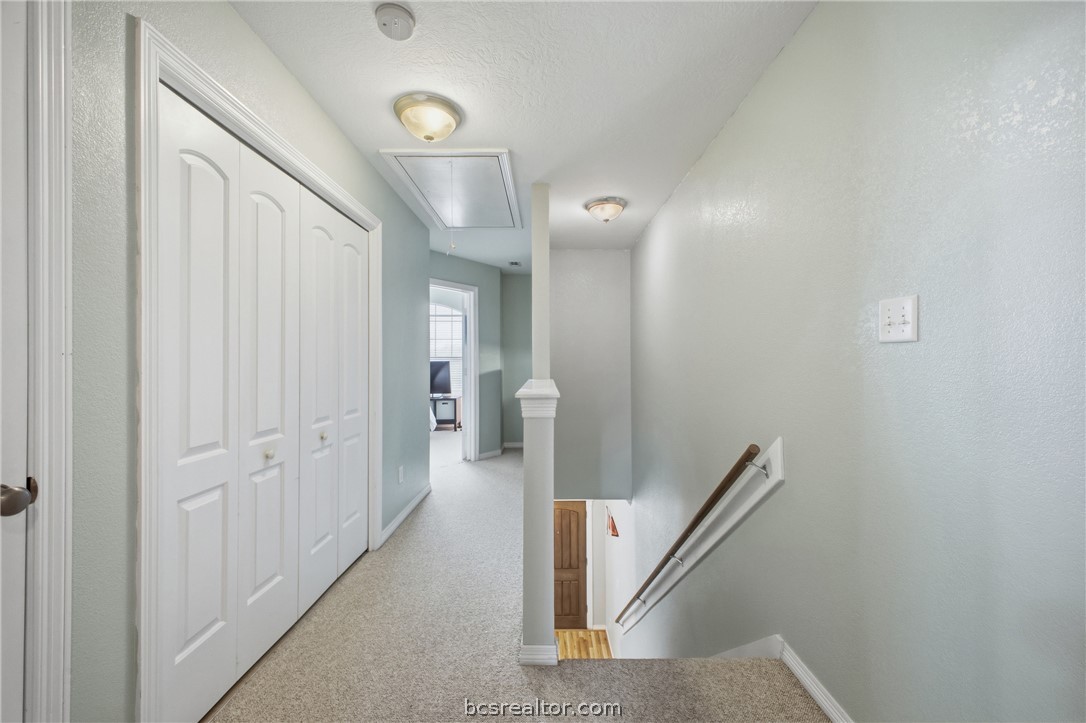 1000 Spring Loop, Unit 2105 College Station, TX 77840 - Photo 10 of 22 a view of a hallway with closet area