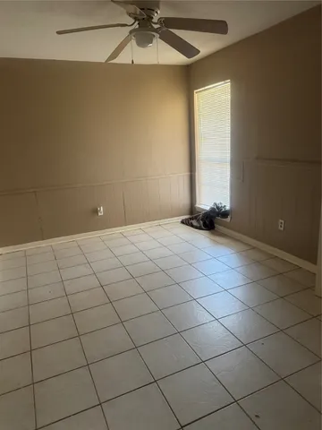 a view of an empty room and window