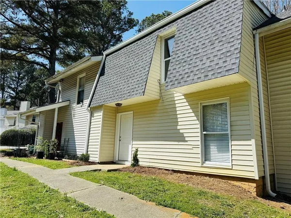 a side view of a house with garage