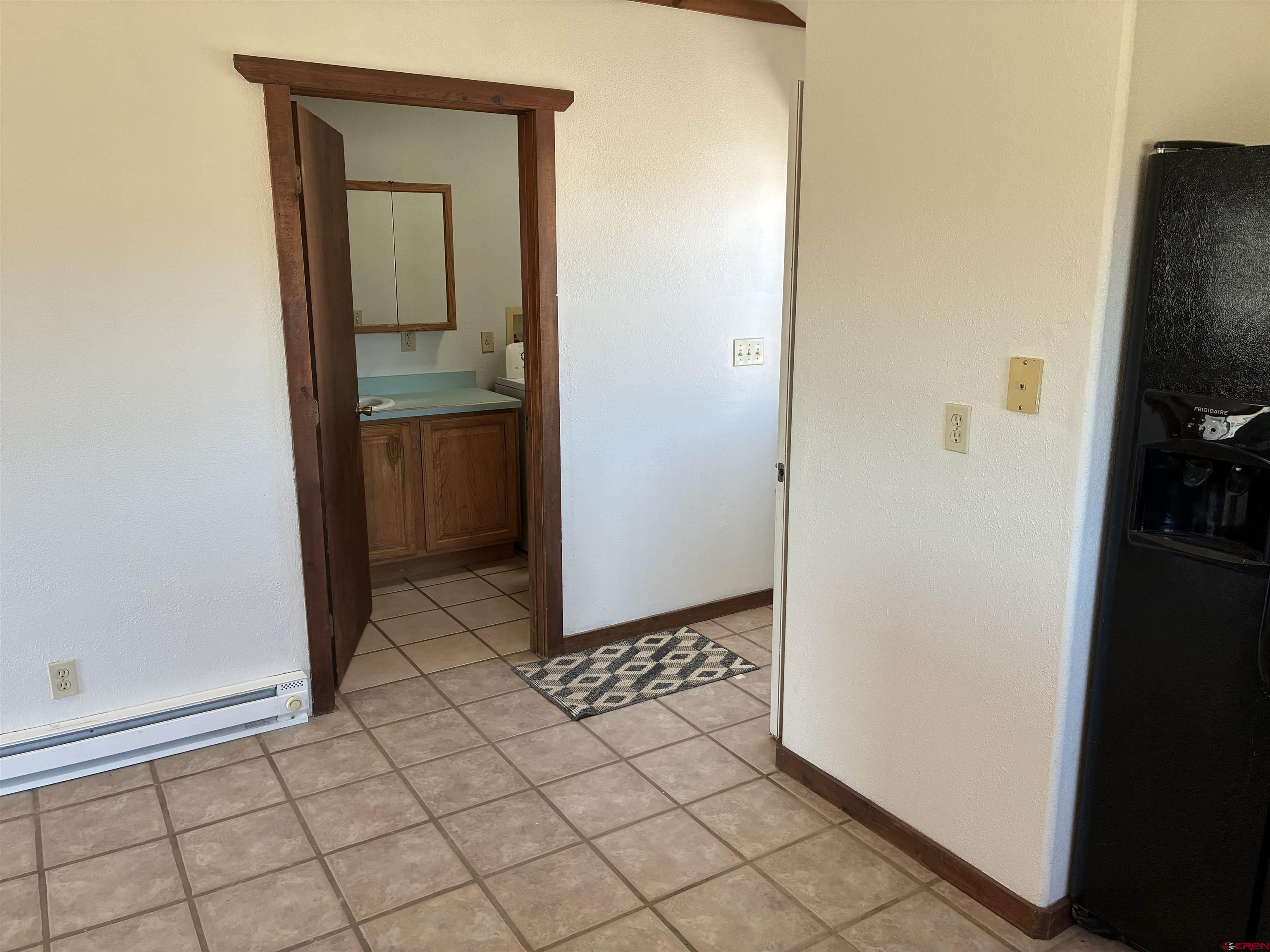 4491 2300th Road Delta, CO 81416 - Photo 6 of 25 a view of a kitchen from a hallway