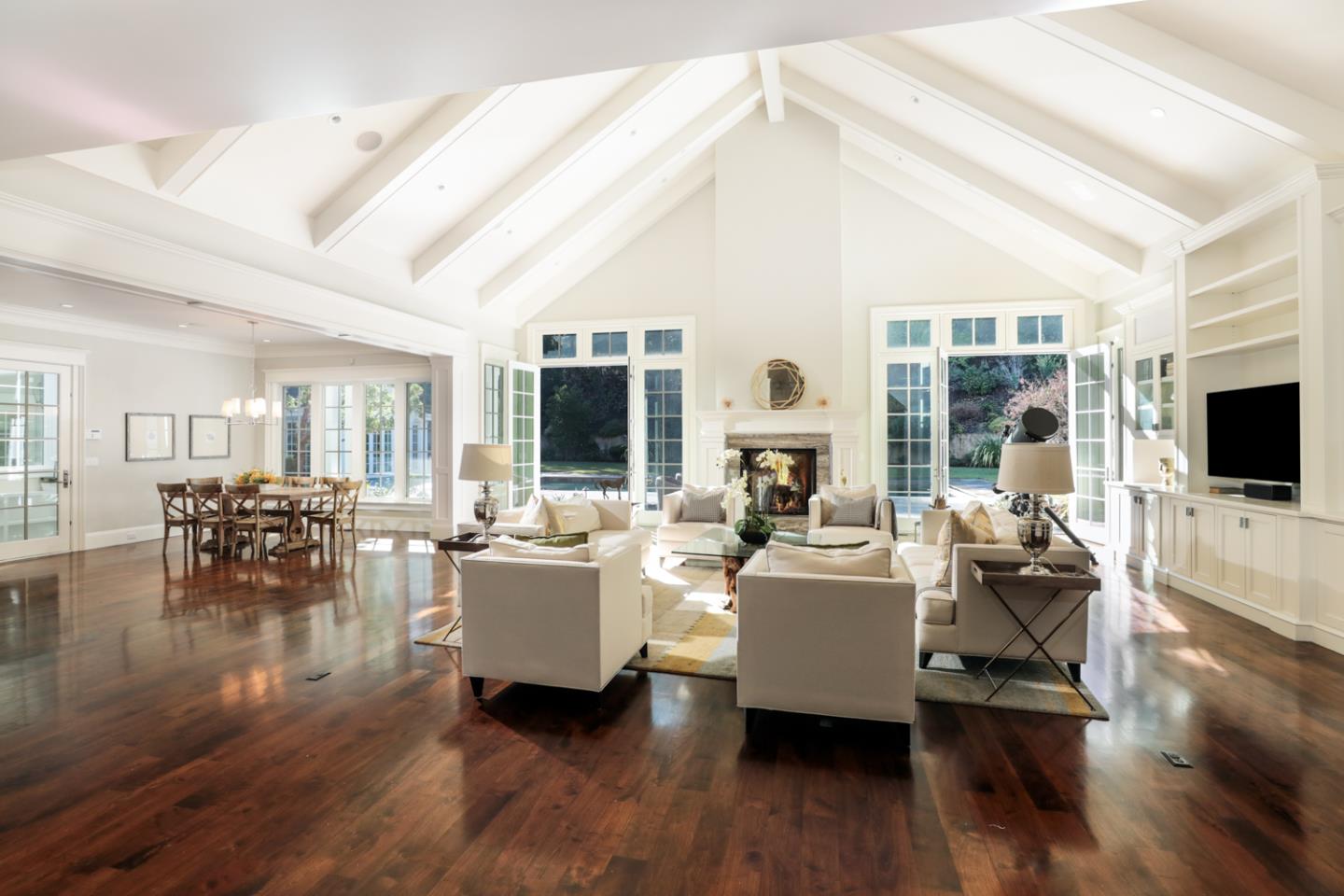 1 Sutherland Drive Atherton, CA 94027 - Photo 16 of 32 a living room with fireplace furniture and a flat screen tv