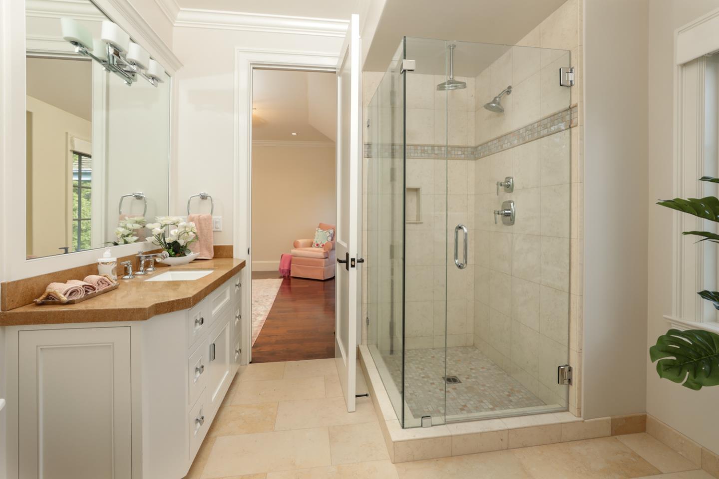 1 Sutherland Drive Atherton, CA 94027 - Photo 19 of 32 a spacious bathroom with a shower sink and mirror