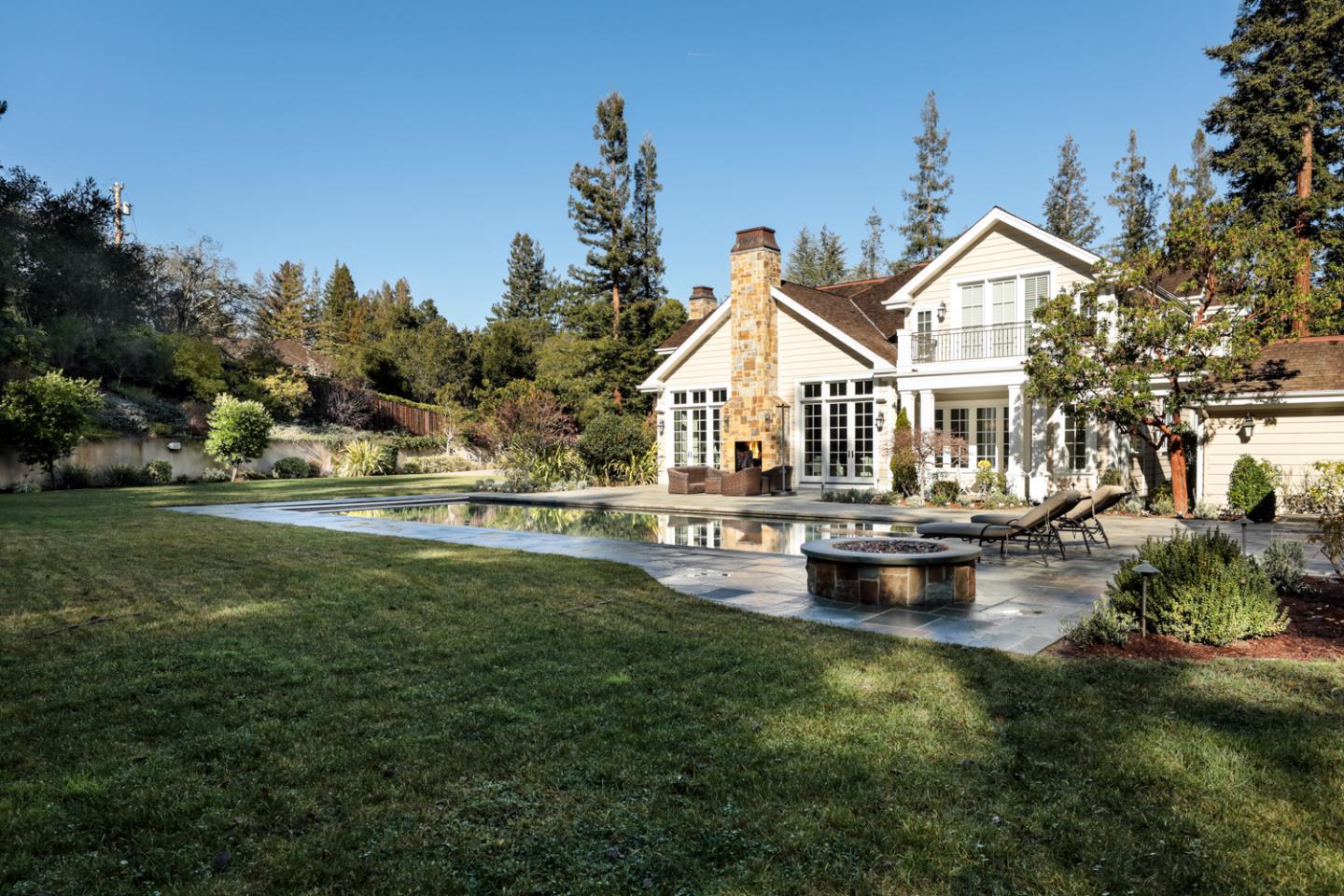 1 Sutherland Drive Atherton, CA 94027 - Photo 22 of 32 a front view of a house with swimming pool having outdoor seating
