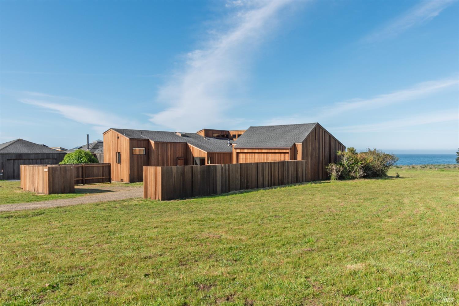 39153 Curlew Reach The Sea Ranch, CA 95497 - Photo 1 of 31 a view of a big room with wooden cabinet and a yard