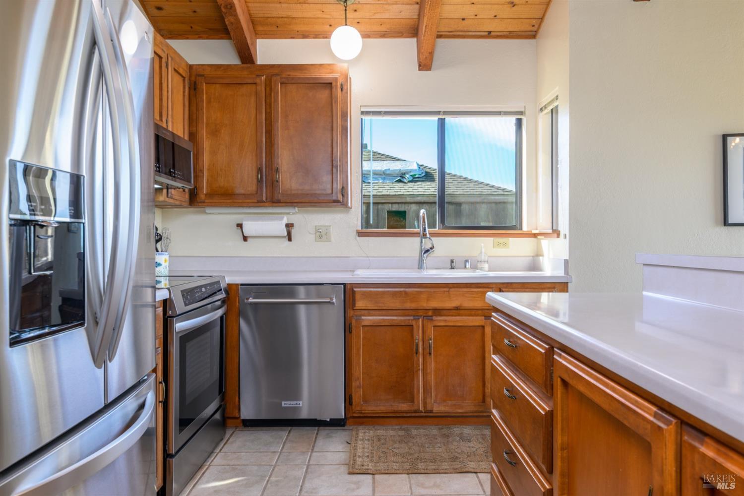 39153 Curlew Reach The Sea Ranch, CA 95497 - Photo 17 of 31 a kitchen with stainless steel appliances granite countertop a sink stove and refrigerator