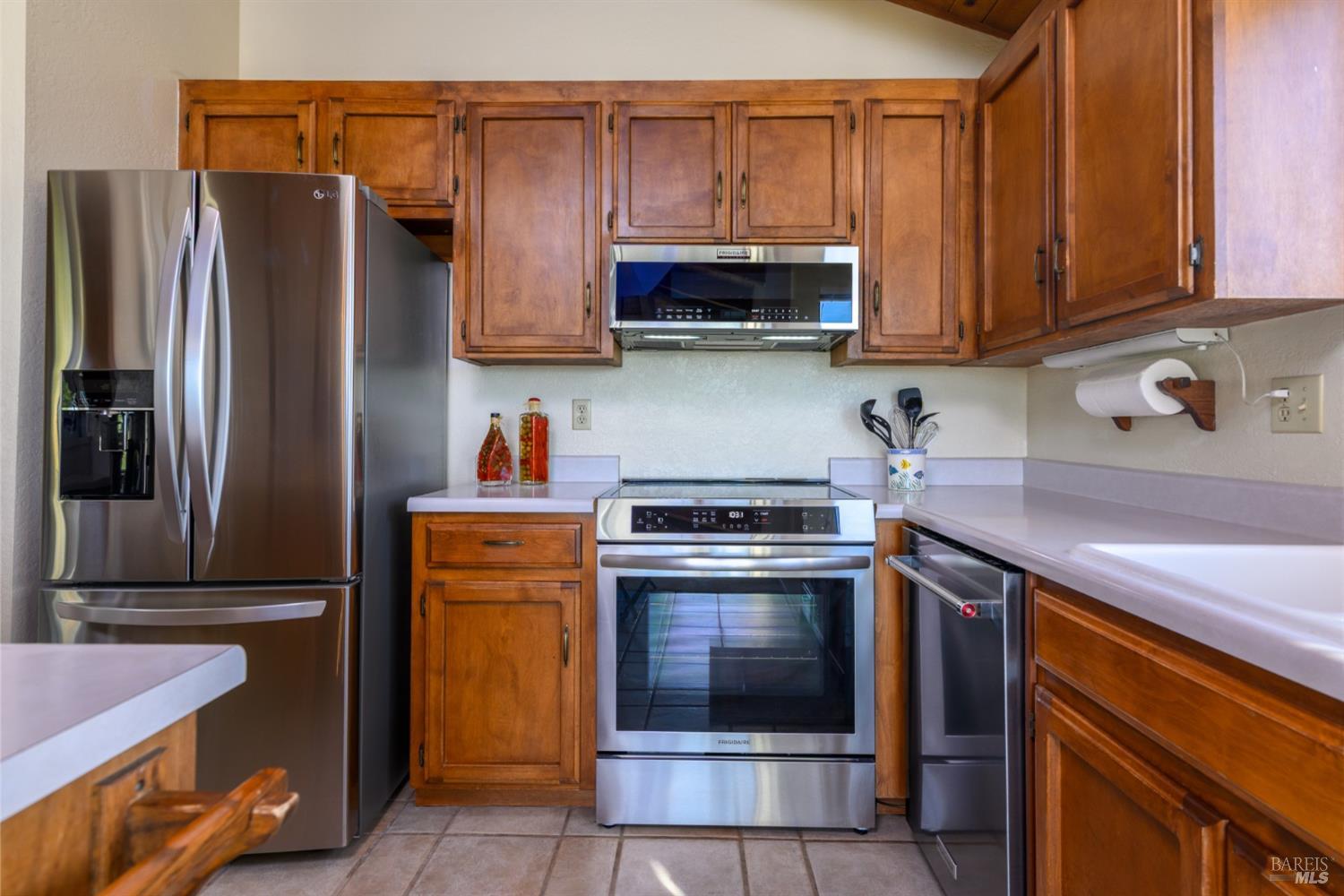 39153 Curlew Reach The Sea Ranch, CA 95497 - Photo 18 of 31 a kitchen with stainless steel appliances granite countertop a refrigerator stove and sink
