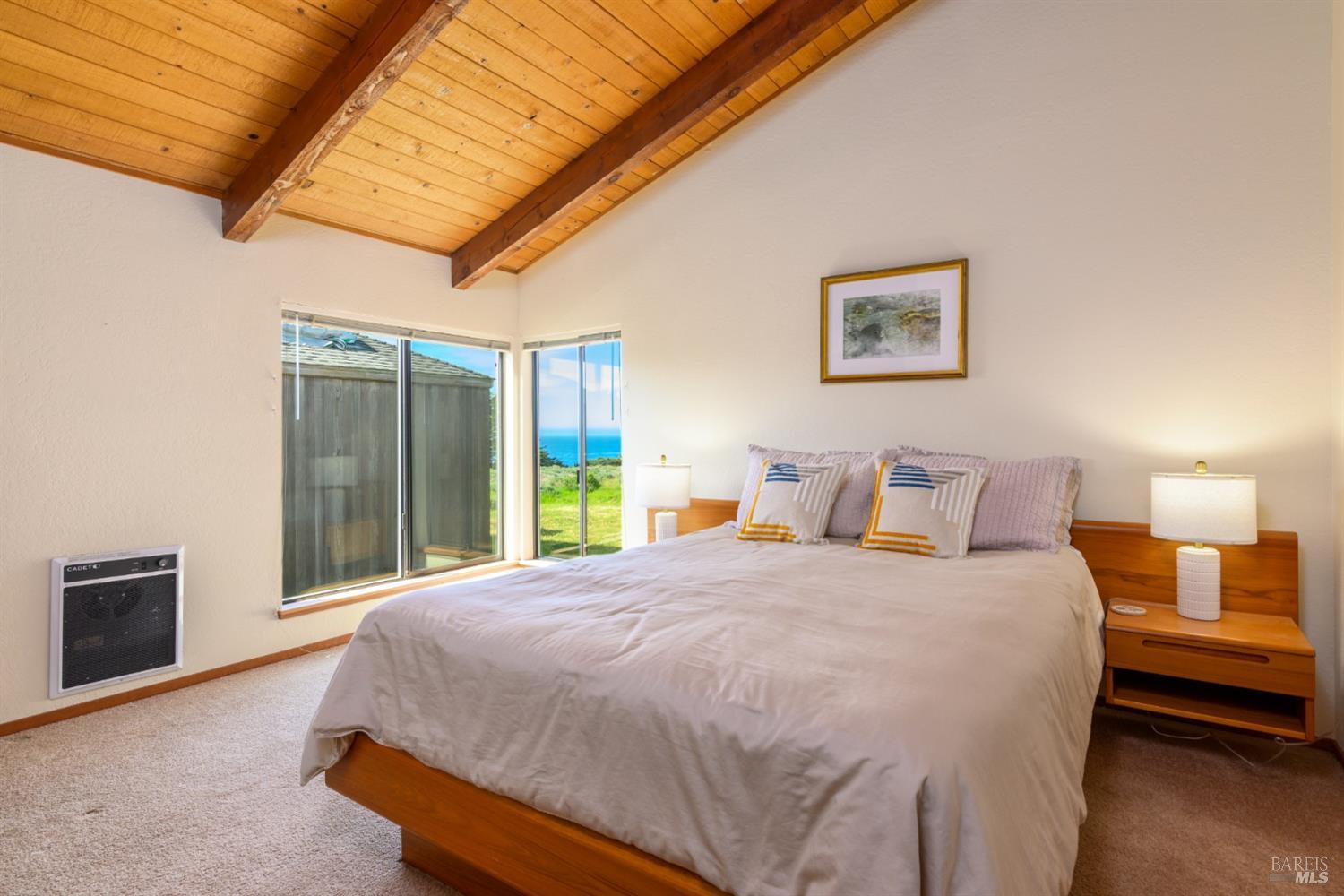39153 Curlew Reach The Sea Ranch, CA 95497 - Photo 20 of 31 a spacious bedroom with a bed and a large window