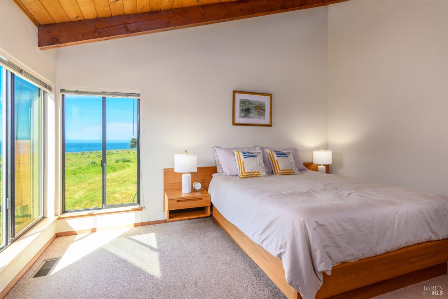 39153 Curlew Reach The Sea Ranch, CA 95497 - Photo 21 of 31 a bedroom with a bed and a large window
