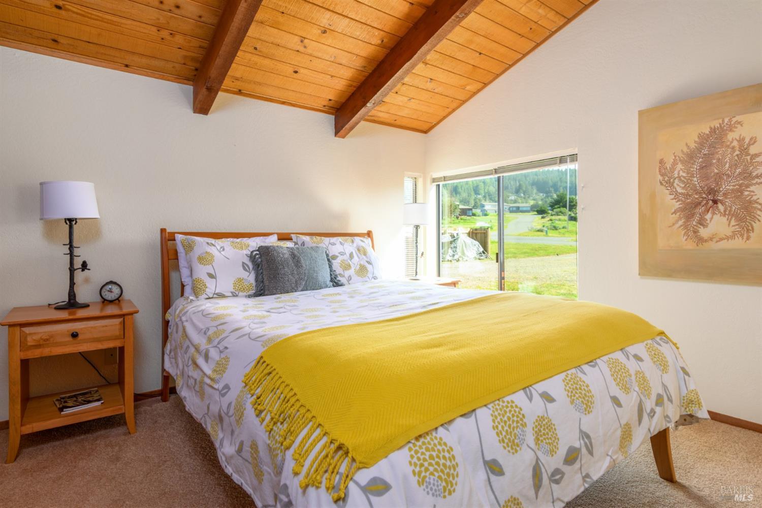 39153 Curlew Reach The Sea Ranch, CA 95497 - Photo 26 of 31 a bed sitting in a bedroom next to a window