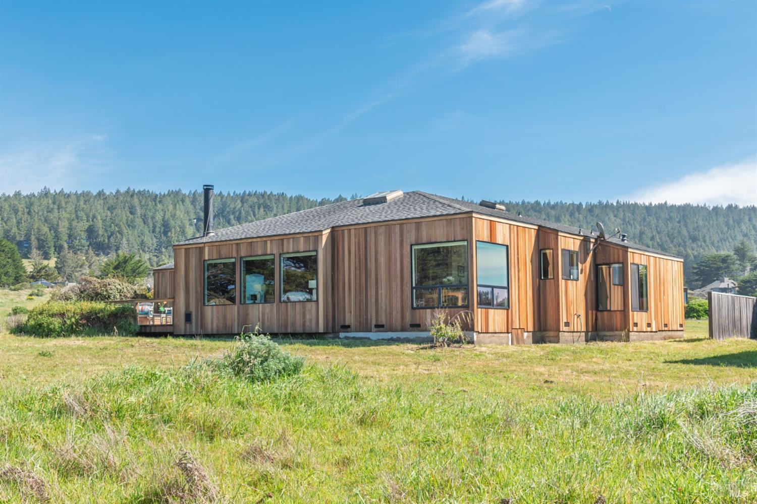 39153 Curlew Reach The Sea Ranch, CA 95497 - Photo 3 of 31 a view of a house with yard and porch