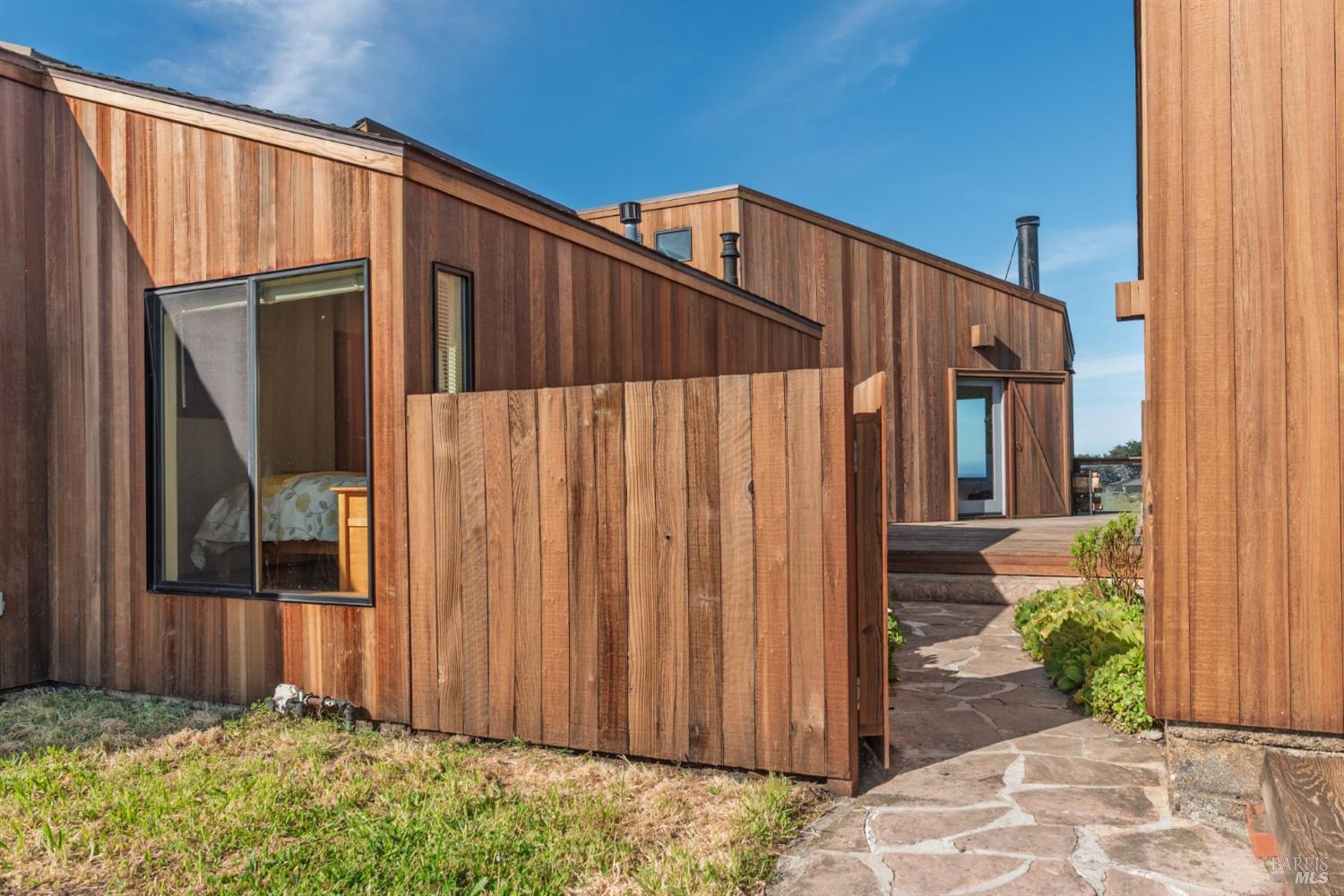 39153 Curlew Reach The Sea Ranch, CA 95497 - Photo 4 of 31 a view of a house with backyard and wooden fence