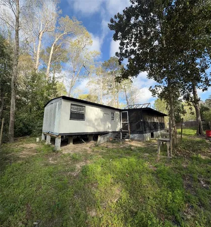 a view of a back yard of the house