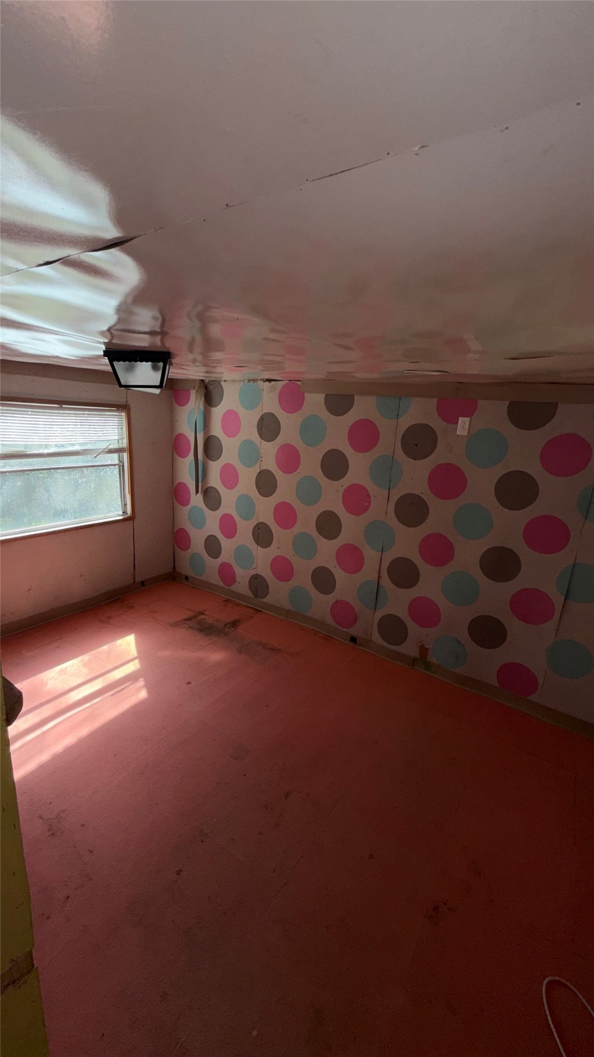 504 Bob Wills Road Livingston, TX 77351 - Photo 14 of 15 a view of an empty room with a window