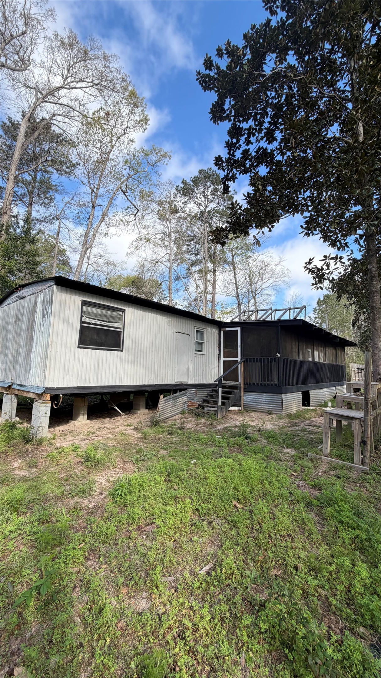 504 Bob Wills Road Livingston, TX 77351 - Photo 2 of 15 a view of back yard of the house