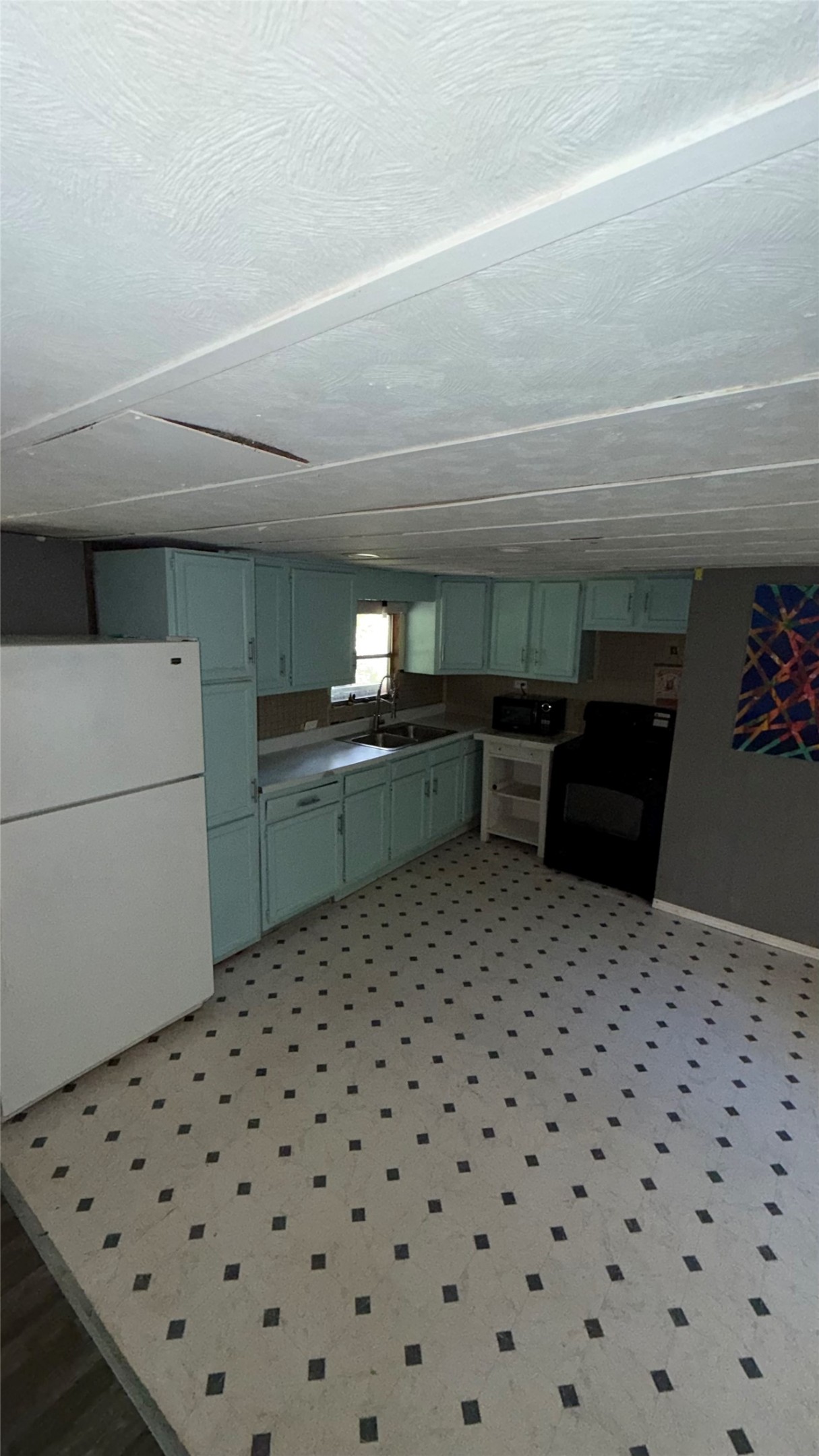 504 Bob Wills Road Livingston, TX 77351 - Photo 8 of 15 a room with a bed and a cabinets