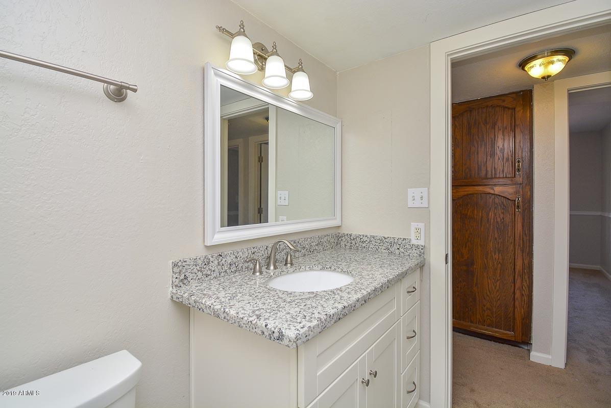 3935 West Calavar Road Phoenix, AZ 85053 - Photo 14 of 27 Hall Bath Vanity