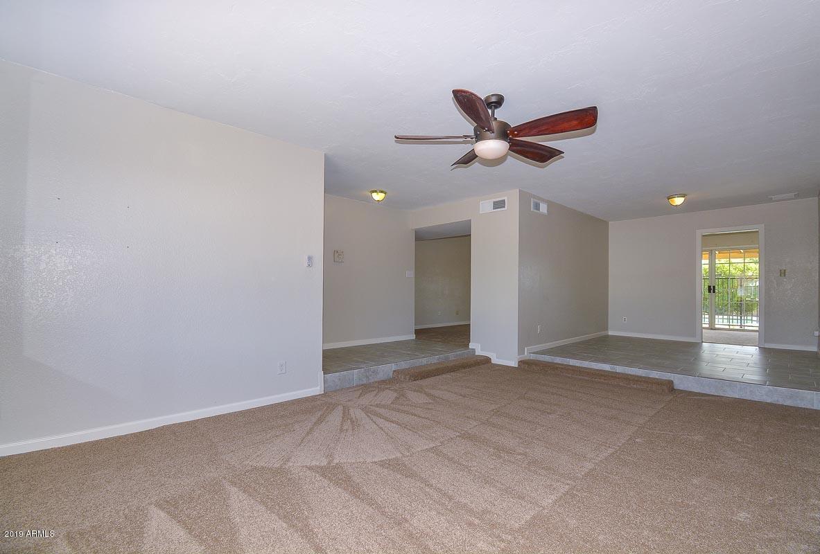 3935 West Calavar Road Phoenix, AZ 85053 - Photo 3 of 27 Living Room-Dining Room