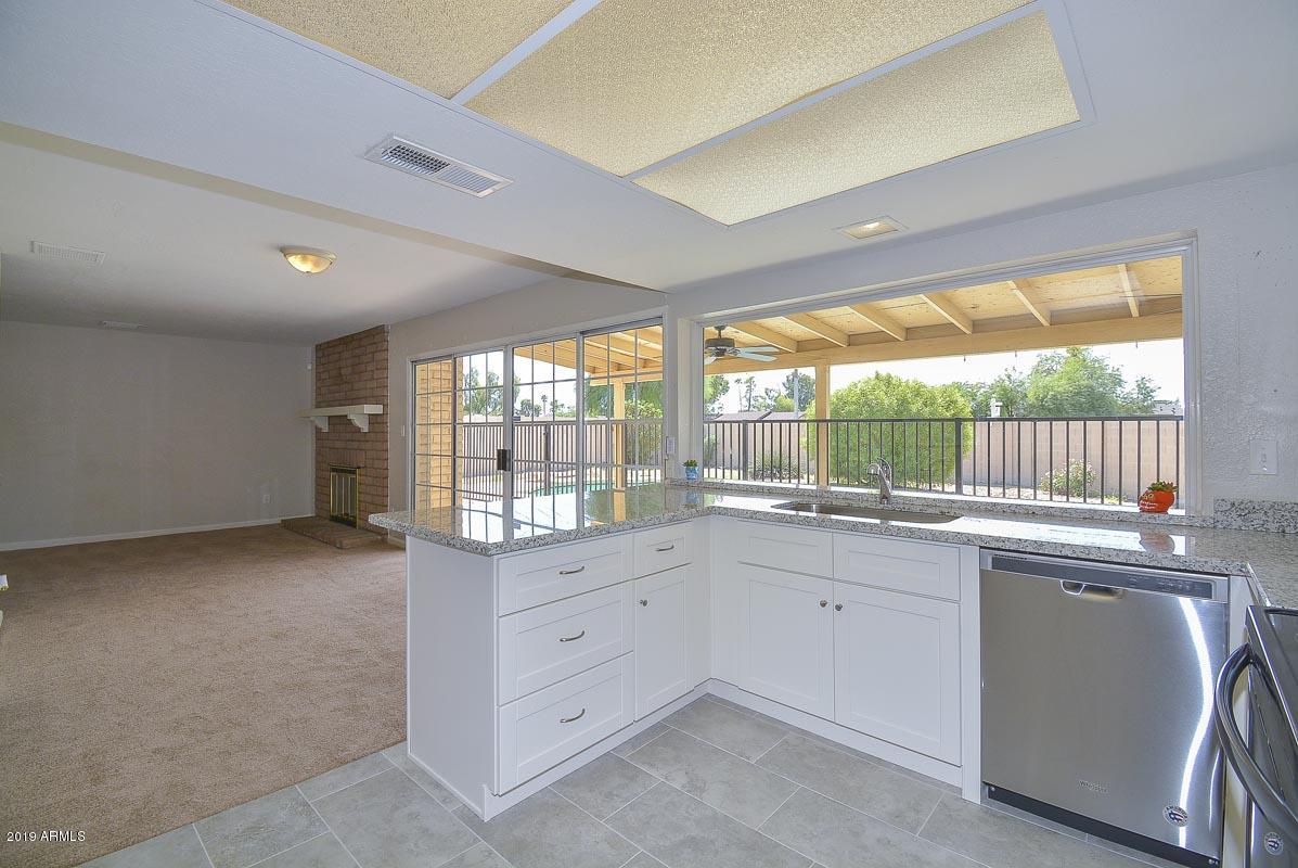 3935 West Calavar Road Phoenix, AZ 85053 - Photo 9 of 27 Kitchen-Family Room
