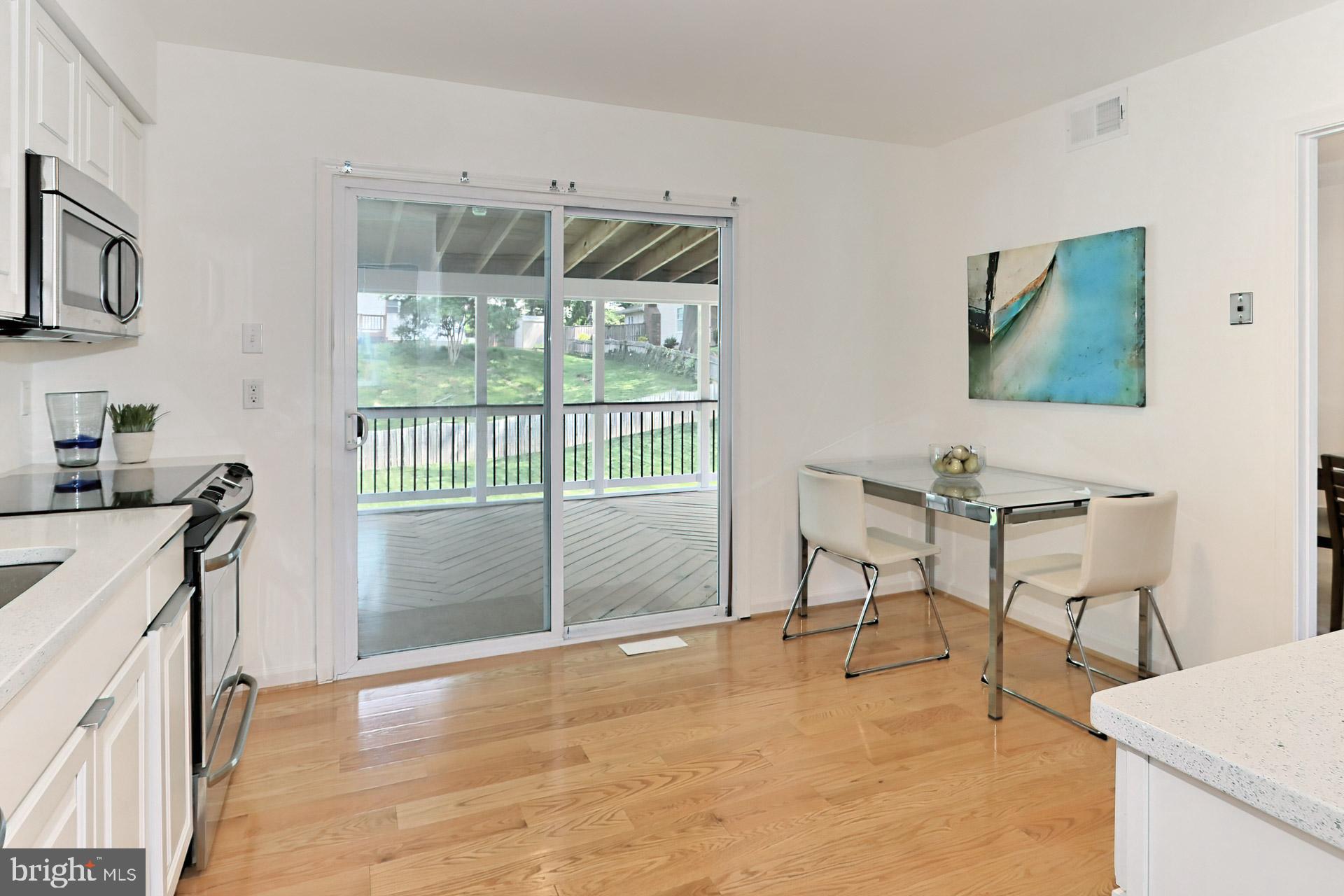 9110 Rockefeller Lane Springfield, VA 22153 - Photo 15 of 56 Table space kitchen features hardwood floors