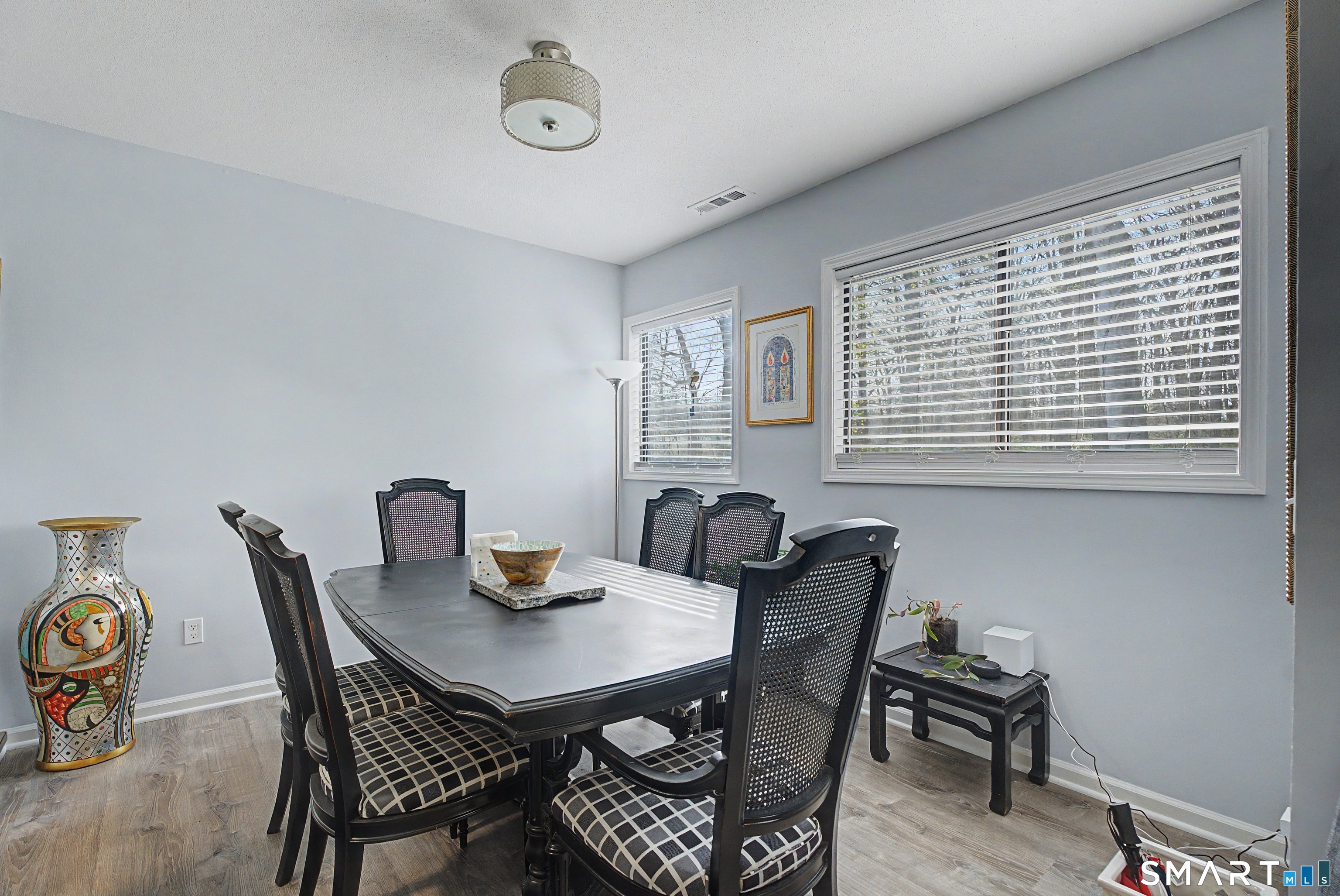 900 Mix Avenue, Unit 60 Hamden, CT 06514 - Photo 11 of 21 a view of a dining room with a table and chairs
