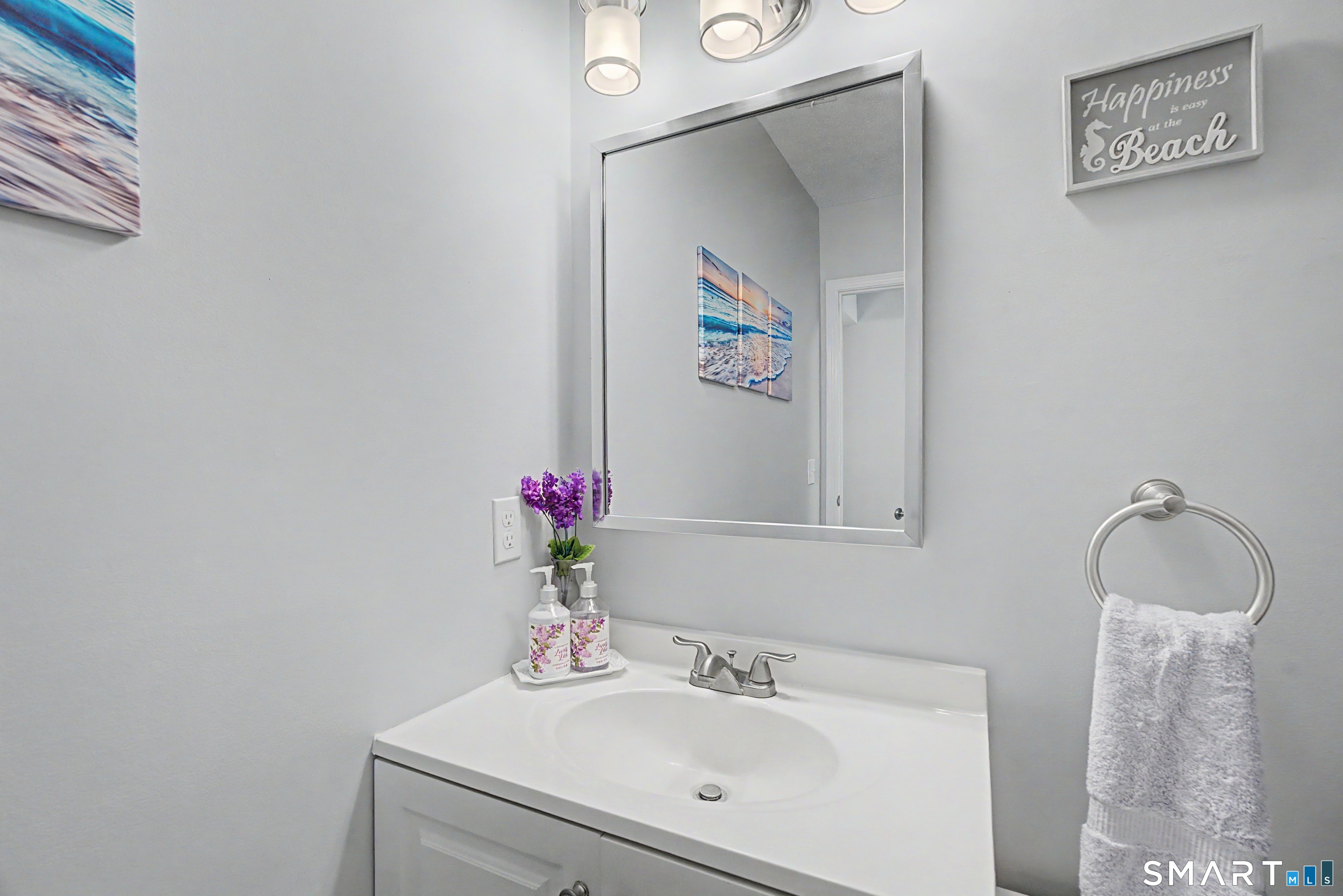 900 Mix Avenue, Unit 60 Hamden, CT 06514 - Photo 13 of 21 a bathroom with a sink and a mirror
