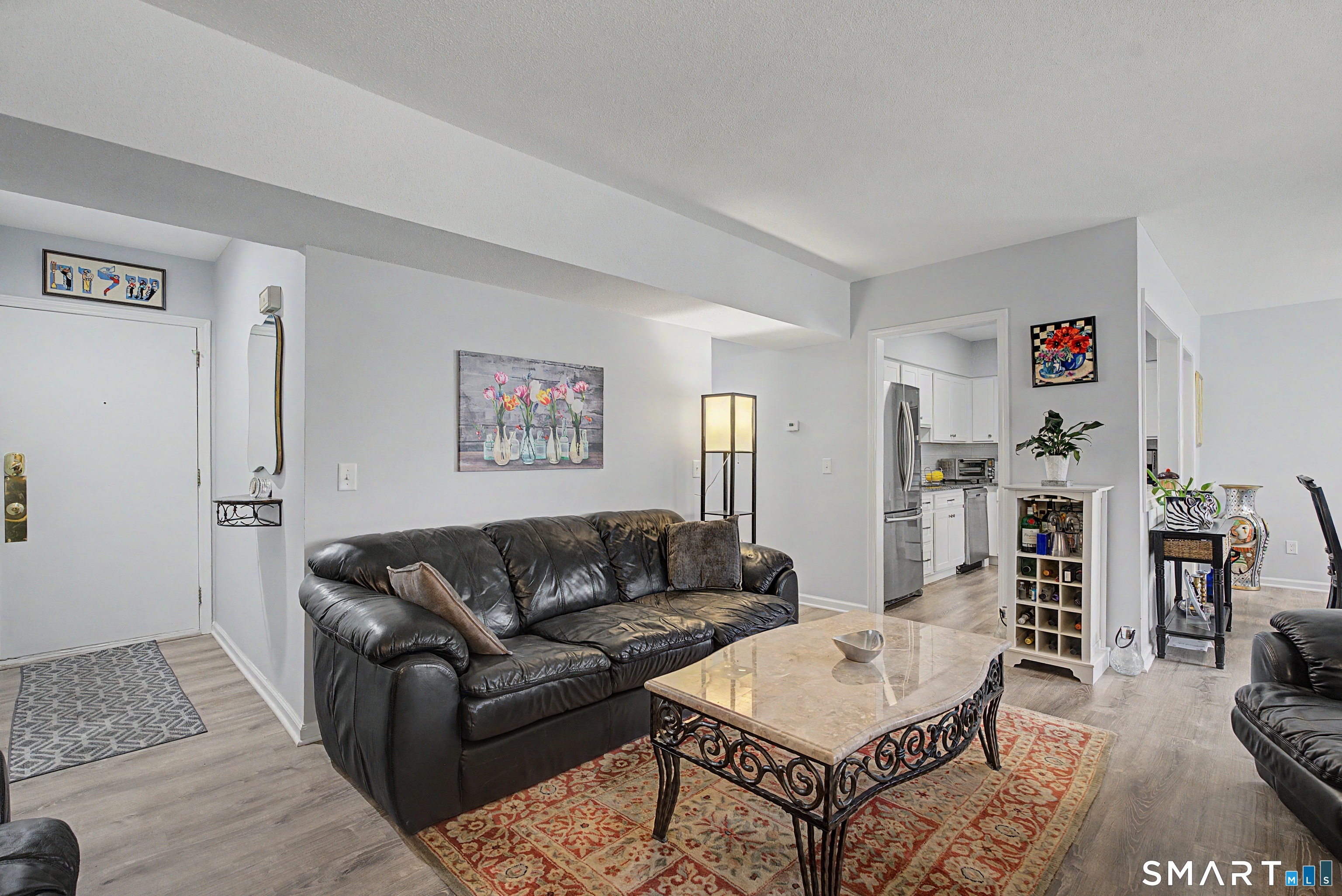 900 Mix Avenue, Unit 60 Hamden, CT 06514 - Photo 5 of 21 a living room with furniture and a couch