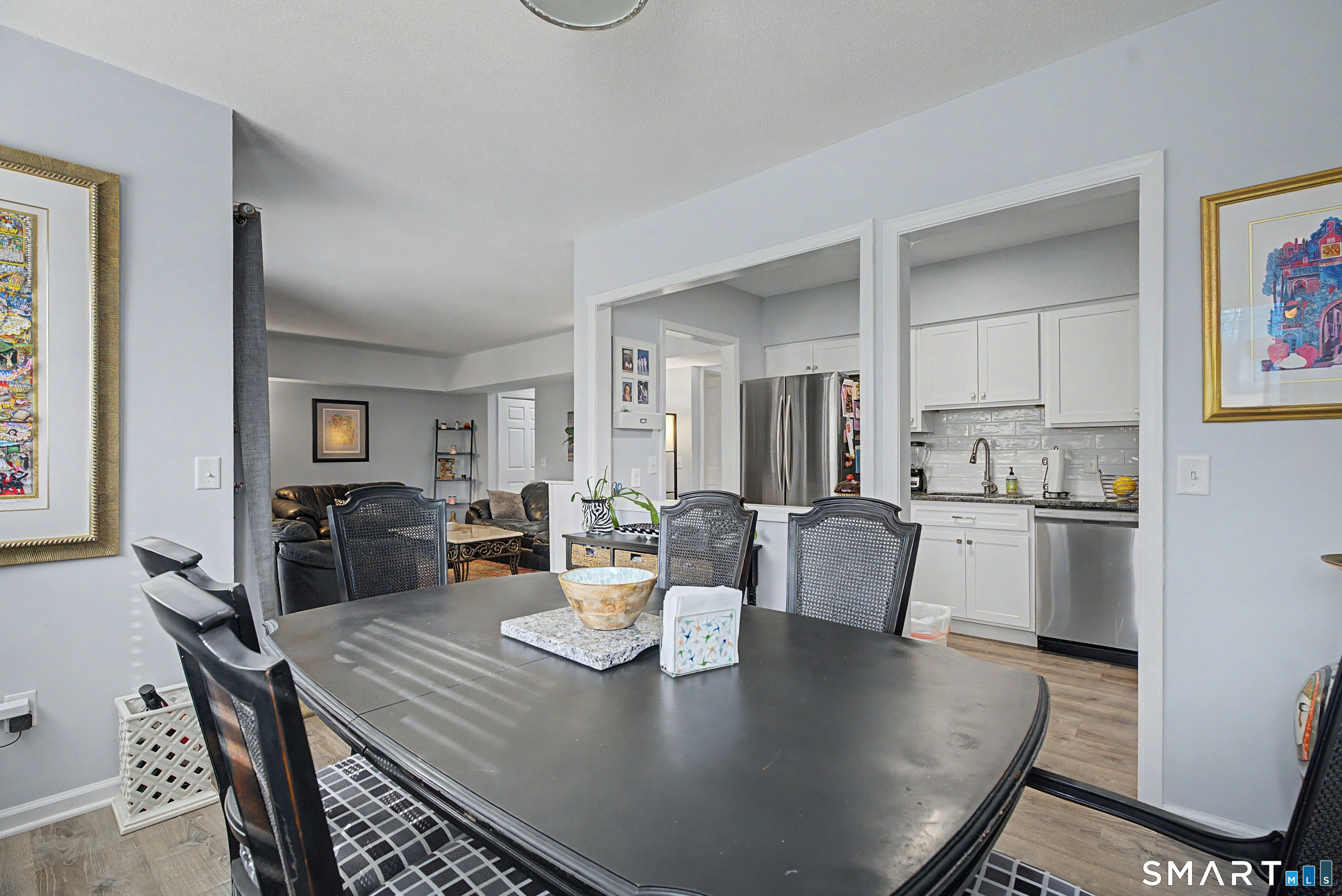 900 Mix Avenue, Unit 60 Hamden, CT 06514 - Photo 10 of 21 a view of a dining room with furniture and wooden floor