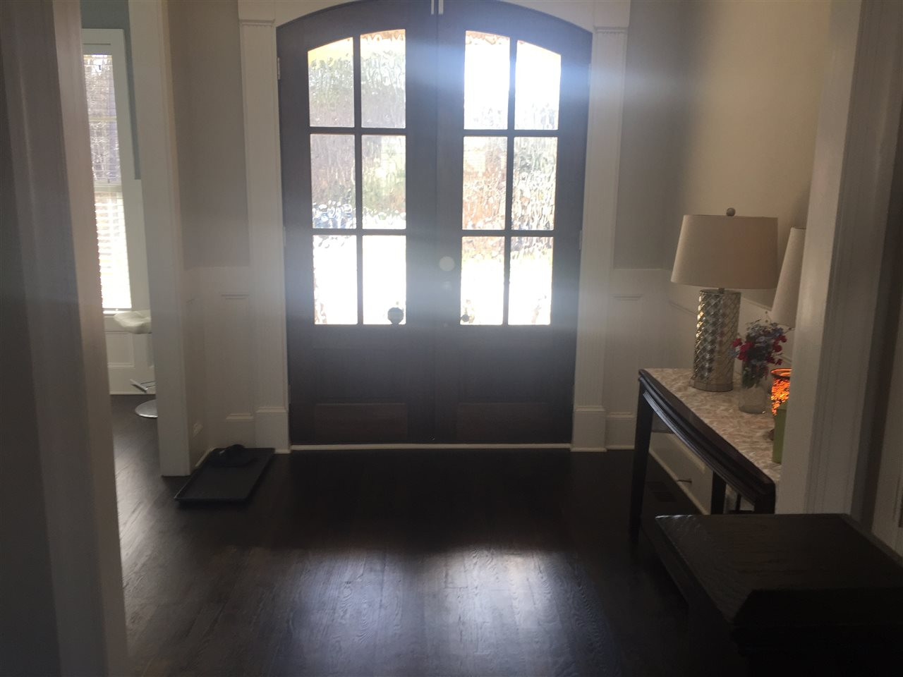 5104 Country Trail Raleigh, NC 27613 - Photo 2 of 3 an empty room with wooden floor and windows