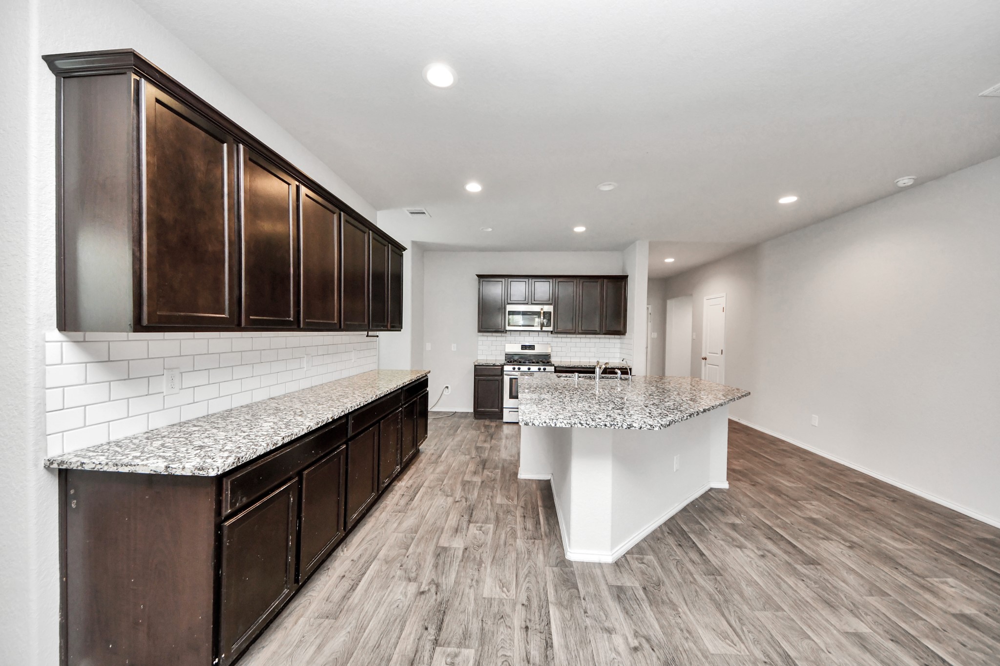 8302 Rose Petals Lane Rosharon, TX 77583 - Photo 36 of 42 Large kitchen island with abundant cabinet space