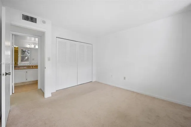 an empty room with a bathroom