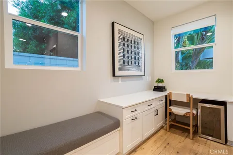 a room with a wooden floor and a window