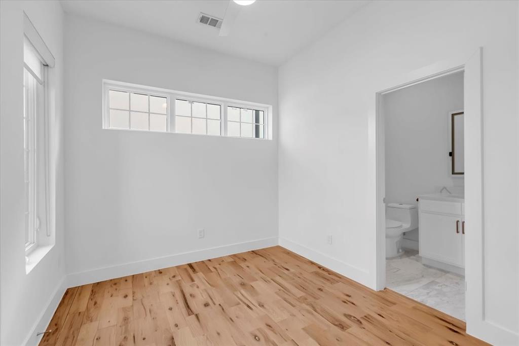 1910 Caddo Street, Unit A205 Dallas, TX 75204 - Photo 19 of 36 wooden floor in an empty room