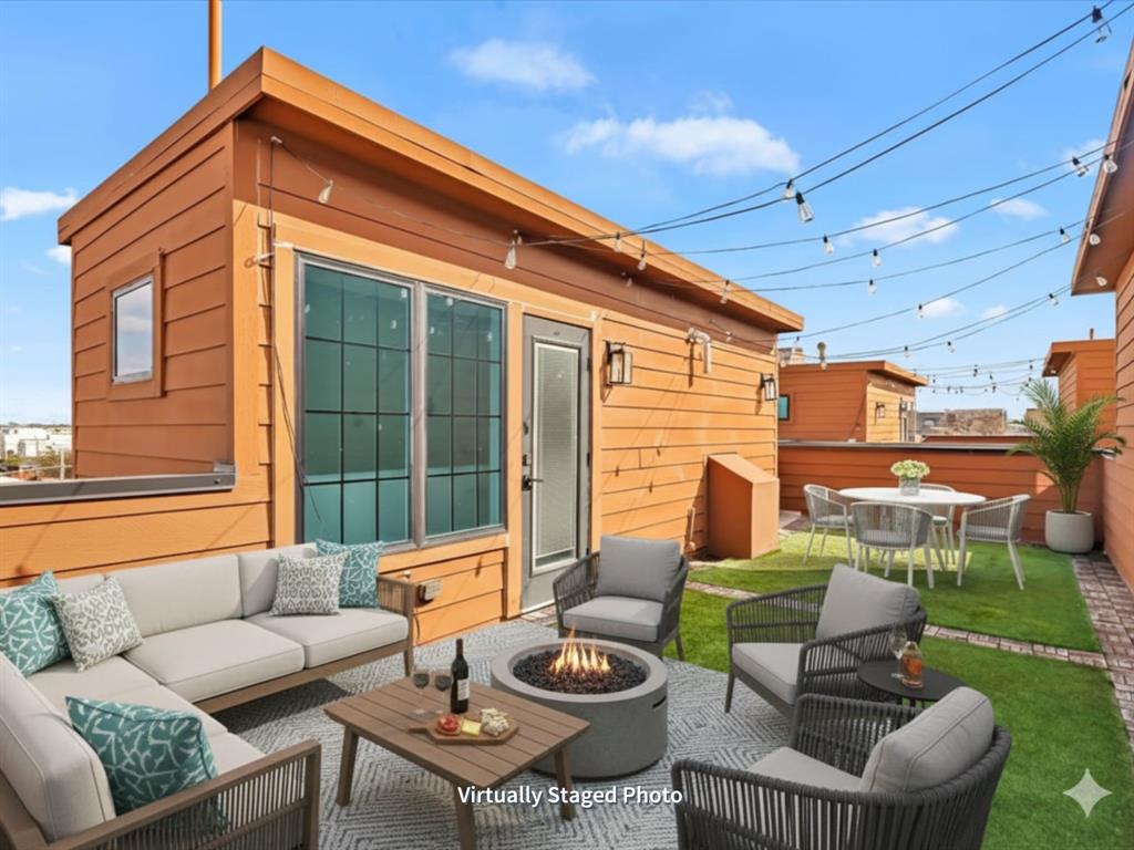 1910 Caddo Street, Unit A205 Dallas, TX 75204 - Photo 29 of 36 a outdoor living space with patio furniture and a potted plant