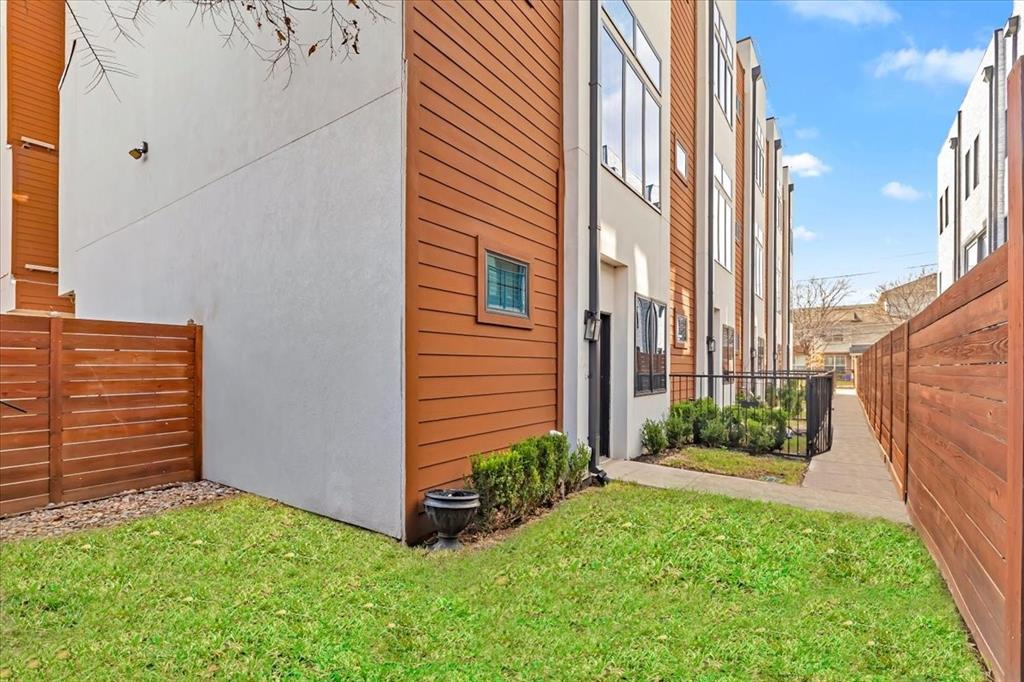 1910 Caddo Street, Unit A205 Dallas, TX 75204 - Photo 4 of 36 a view of a back yard of the house