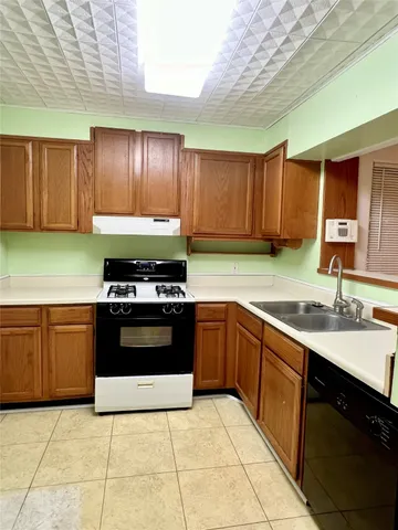 a kitchen with a sink and a stove