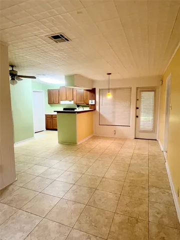 a open kitchen with a sink and cabinets