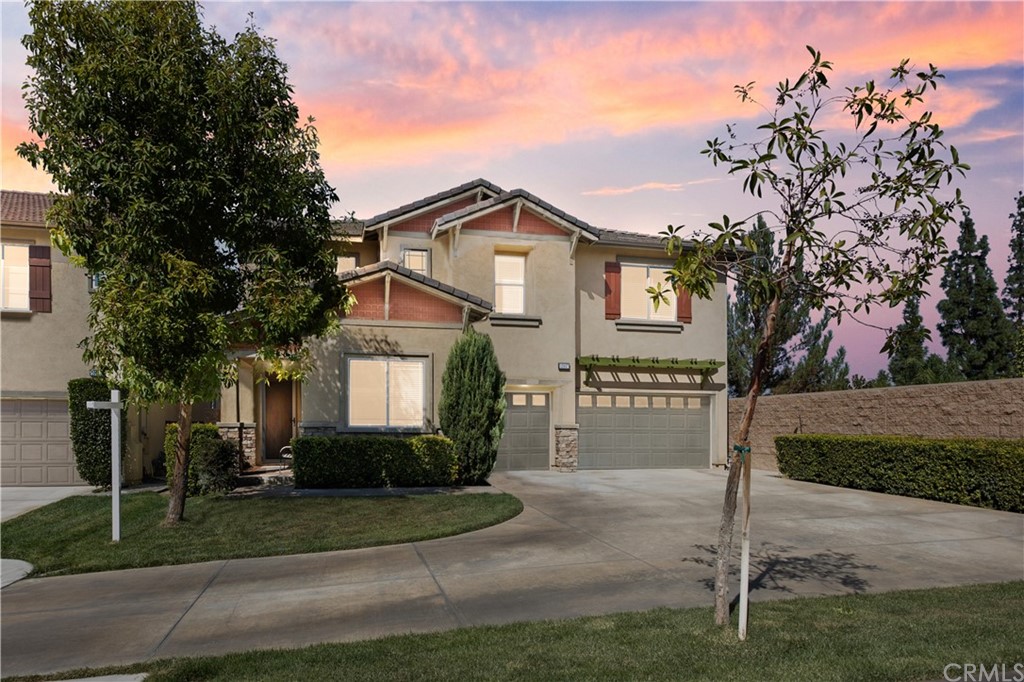 10807 Hanford Way Riverside, CA 92503 - Photo 1 of 1 a front view of a house with a yard and garage